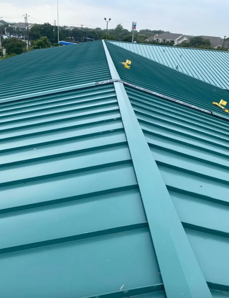 Green commercial metal roof ridge and valley for Metal Roof Repair in Huron
